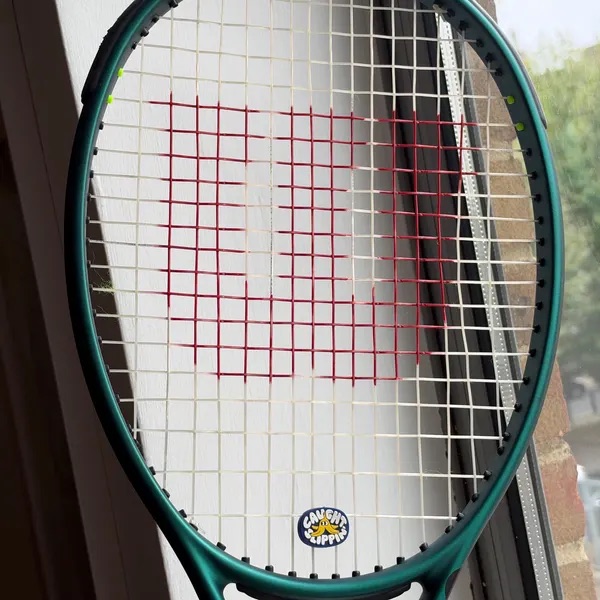 Alessia's Caught Slippin' dampener on her green racket